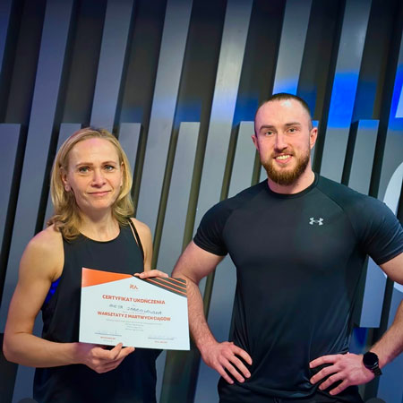 personal trainer Wiktor Kowalski with his client