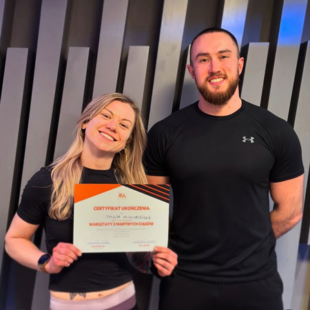personal trainer Wiktor Kowalski with his client