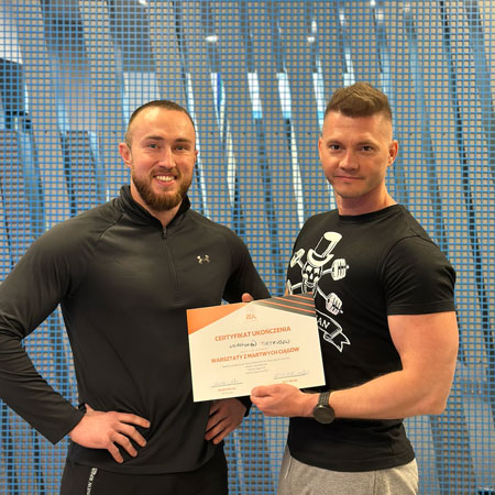 personal trainer Wiktor Kowalski with his client