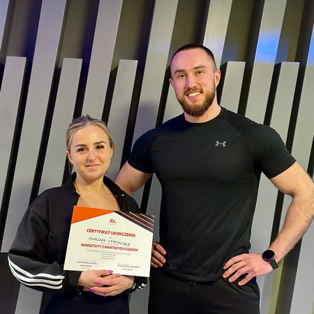 personal trainer Wiktor Kowalski with his client