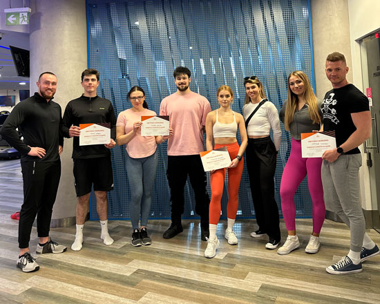personal trainer Wiktor Kowalski with his clients